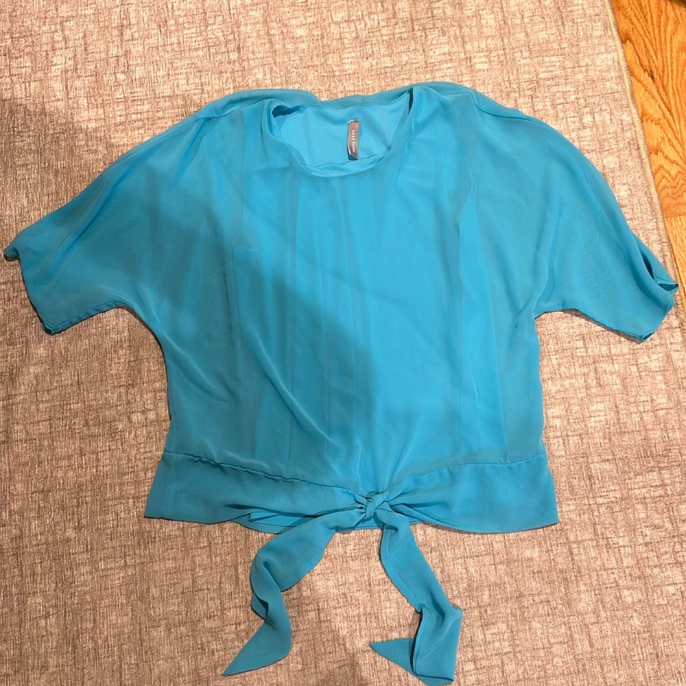 Last Tango light blue polyester top. Size small